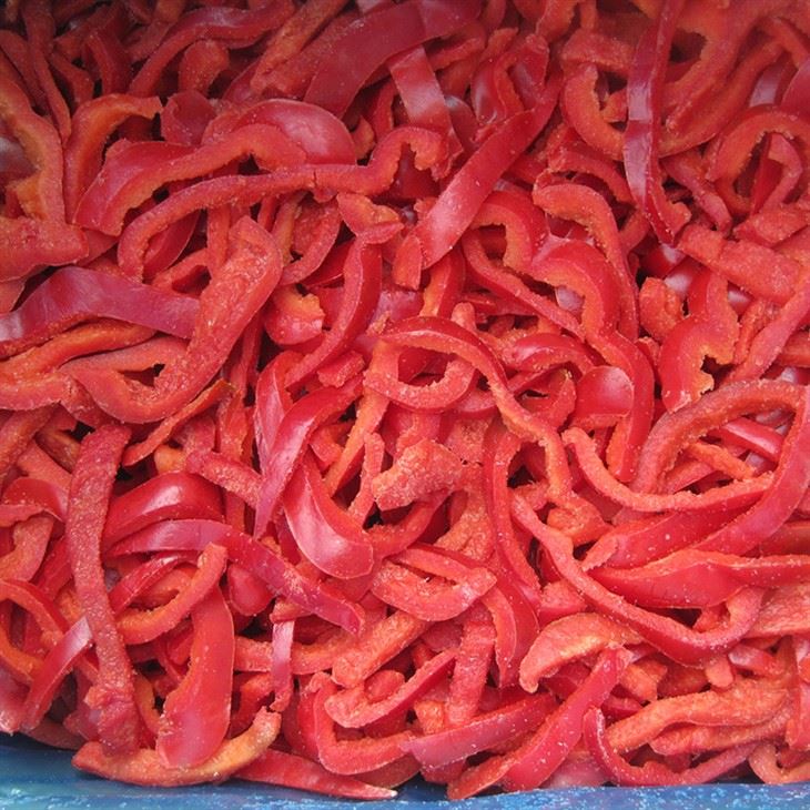 Frozen red bell pepper strips in a loose bulk format