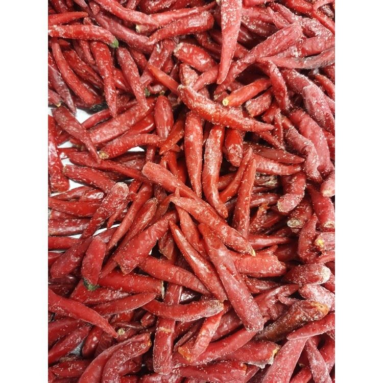 Loose red chilli peppers in a bulk product sample