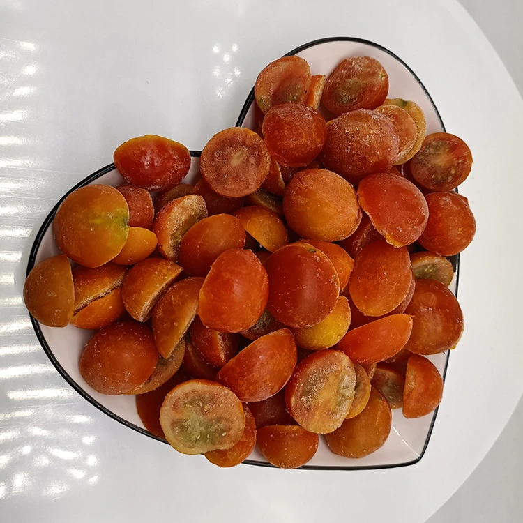 Actual GreenLand frozen cherry tomato halves in a bowl.