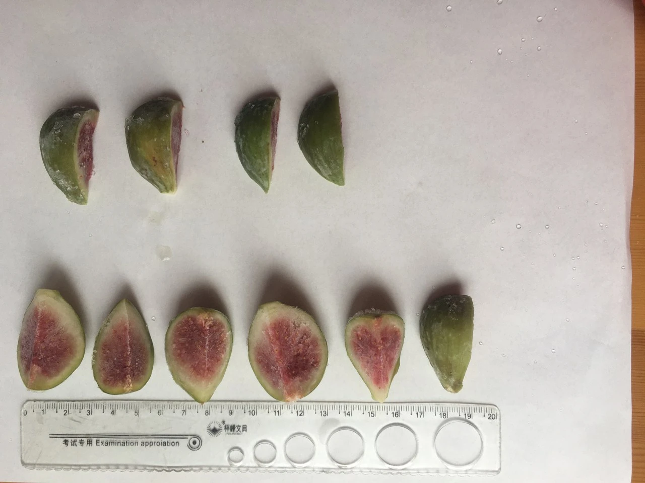 A separate arrangement of cut figs with skin sides and exposed centres A separate arrangement of cut figs with skin sides and exposed centres