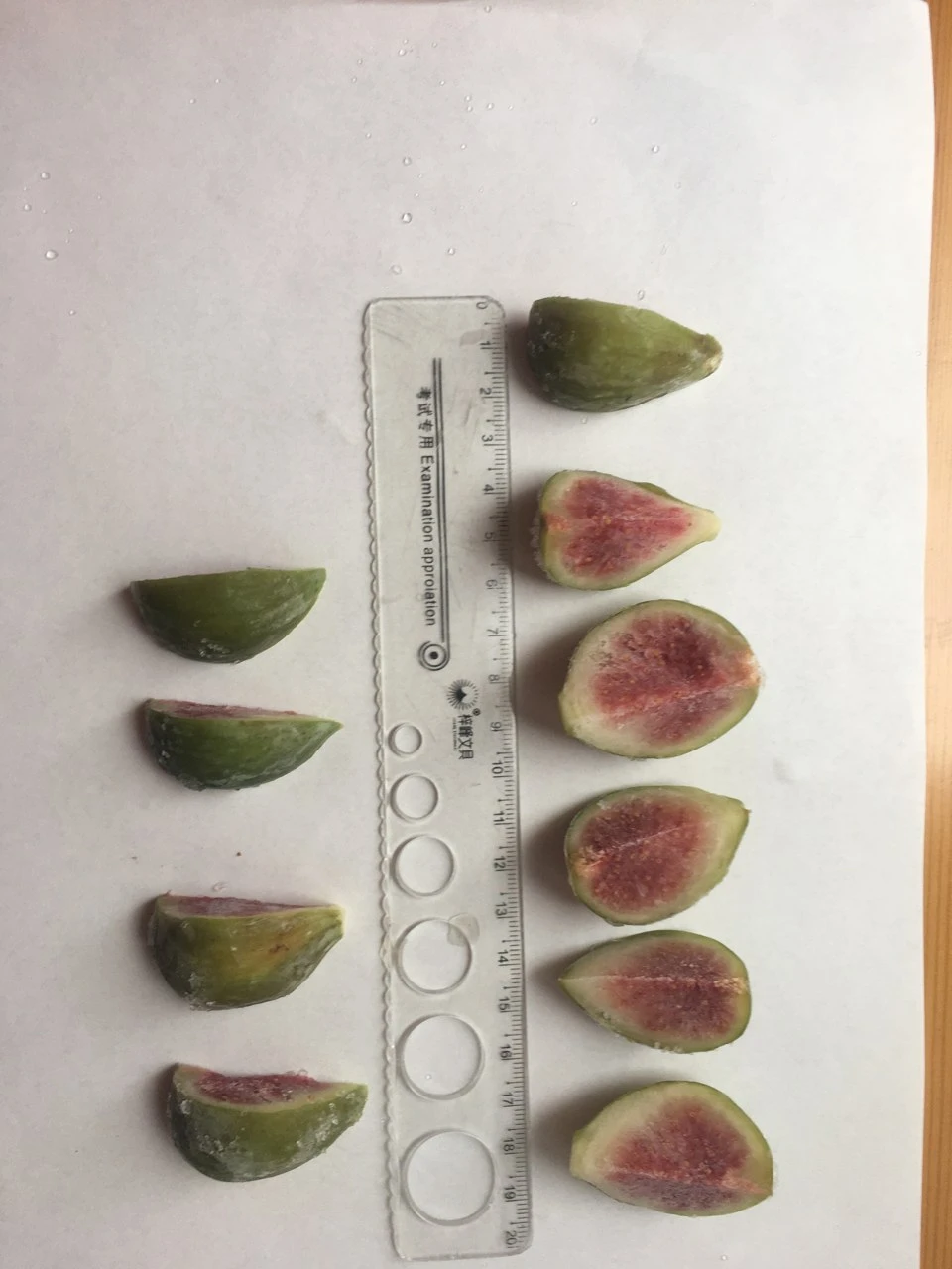 Company-supplied cut fig pieces beside a vertical ruler