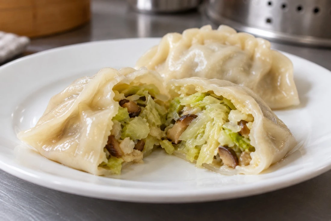Cooked dumpling cross-section with cabbage filling Cooked dumpling cross-section with cabbage filling