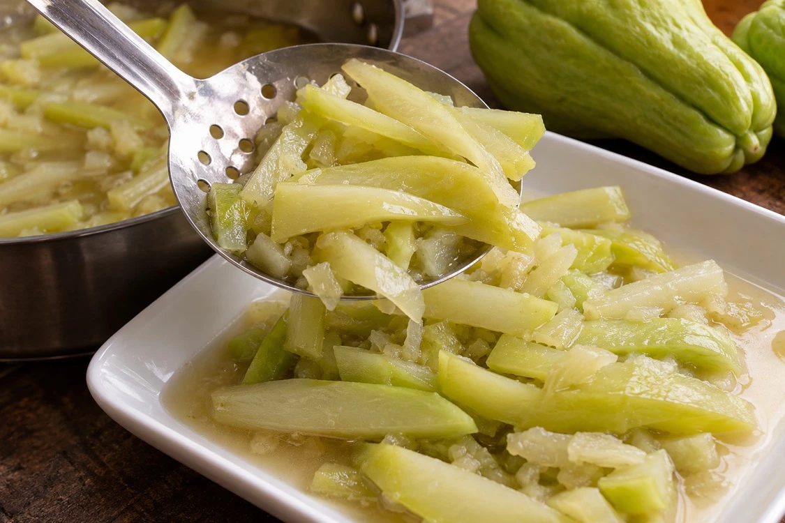 Cooked chayote pieces gently recovered from sauce for inspection Cooked chayote pieces gently recovered from sauce for inspection