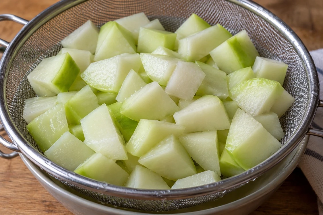 Thawed chayote dice with visible surface moisture Thawed chayote dice with visible surface moisture
