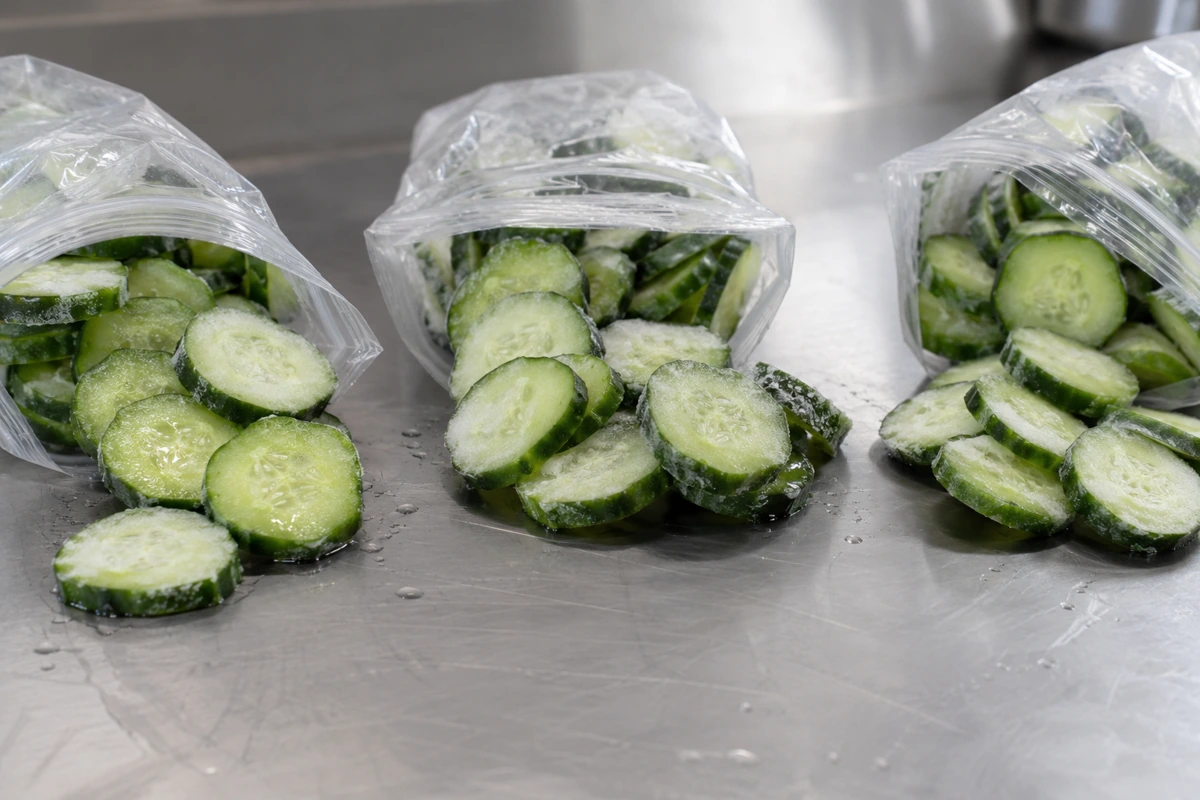 Separate portions of cucumber rounds from plain freezer pouches Separate portions of cucumber rounds from plain freezer pouches