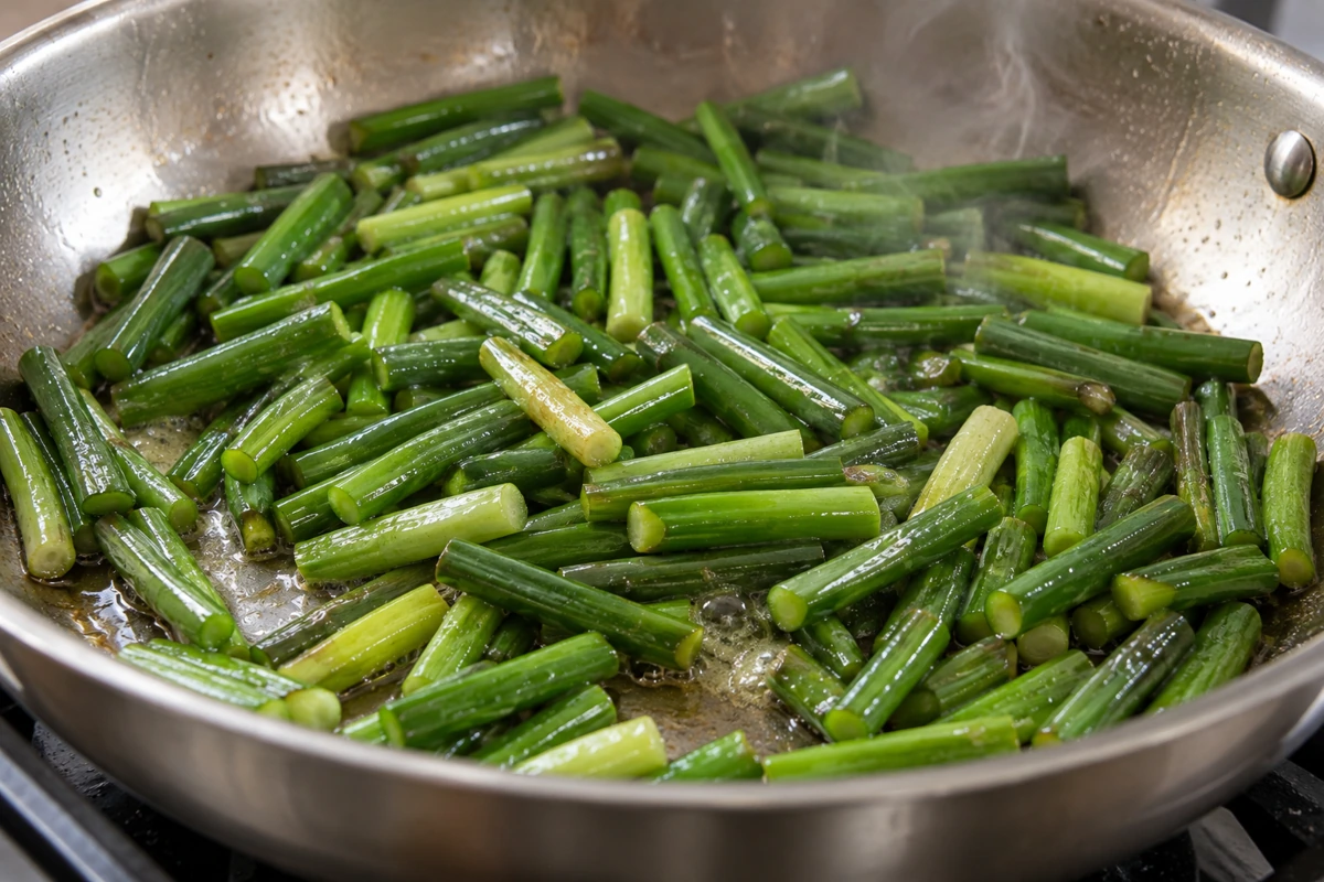 Cut stalk sections remain recognizable as they cook in a shallow pan Cut stalk sections remain recognizable as they cook in a shallow pan