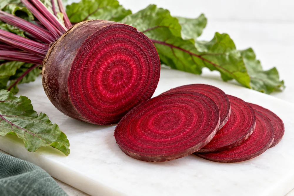Cut red beetroot with concentric rings and thin slices
