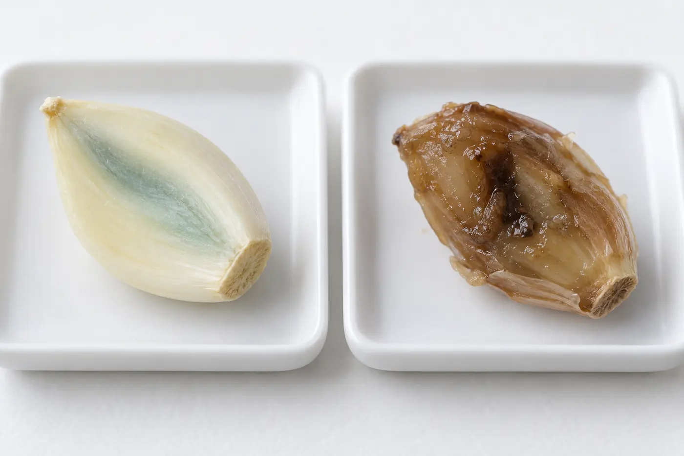 Separate garlic cloves showing smooth internal tint and wet brown damage