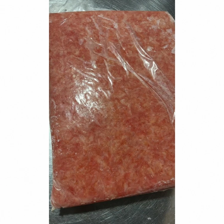 Bag of coarse frozen pink pomelo pulp fragments