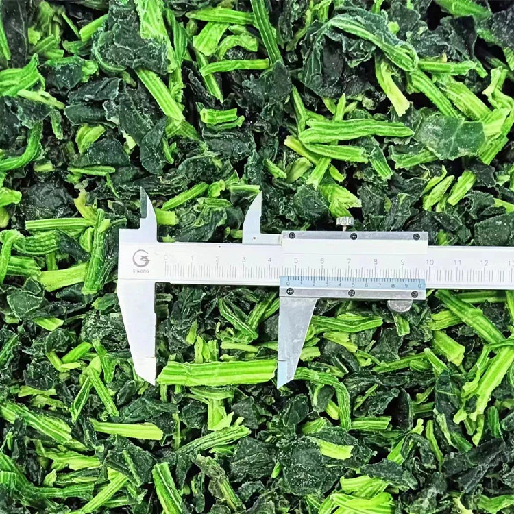 Frozen chopped spinach and stem pieces beside a measuring caliper