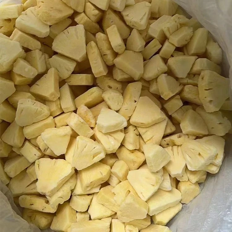 Frozen pineapple pieces showing variation in shape, color and surface condition