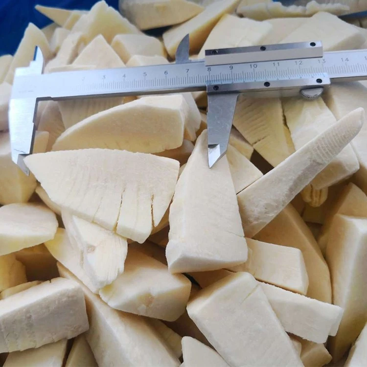 Bamboo shoot slices beside a caliper